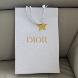 Dior white pebble shopping bag with gold star